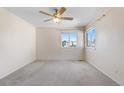 Bright bedroom with neutral carpet, ceiling fan, and lots of natural light at 18897 E Linvale Pl, Aurora, CO 80013