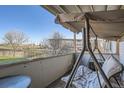 Relaxing balcony with a swing and views of the surrounding neighborhood at 2201 Sable Blvd # 1008, Aurora, CO 80011