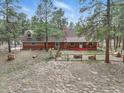 Aerial view of the home's exterior featuring a fenced in yard with mature trees at 17720 Canterbury Dr, Monument, CO 80132