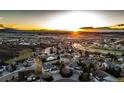 Neighborhood shot at sunset with a backdrop of mountains at 4157 Astrion Ct, Castle Rock, CO 80104