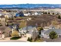 Exterior view of a home with mountain views in the distance at 4157 Astrion Ct, Castle Rock, CO 80104
