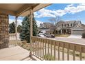 Inviting covered front porch provides a cozy spot to enjoy the outdoors at 7099 Cerney Cir, Castle Pines, CO 80108