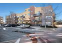 Exterior shot of a multi-unit complex with balconies and on-site parking under a clear sky at 9039 E Panorama Cir # C201, Englewood, CO 80112