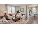 Inviting living room filled with natural light and a comfortable seating area at 1885 Mount Monroe Dr, Berthoud, CO 80513