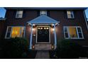 Beautiful front door area showing double doors, lighting and greenery with a welcoming presence at 6953 S Prescott St, Littleton, CO 80120