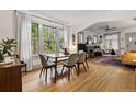 Bright dining room with hardwood floors and large windows at 1602 Garfield St, Denver, CO 80206