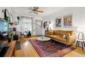 Cozy living room with hardwood floors, stylish furniture, and a ceiling fan at 1602 Garfield St, Denver, CO 80206