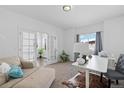 Bright office with plenty of natural light and a view to a sunroom at 10610 E 167Th Pl, Brighton, CO 80602