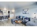Inviting living room featuring plush gray seating, modern decor, and an open layout, perfect for relaxation and entertaining at 800 N Washington St # 508, Denver, CO 80203