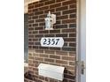 Close up of house number with outdoor lantern, mailbox, and door at 2357 E Mineral Ave, Centennial, CO 80122