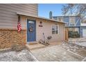 Close-up of the front entry featuring a blue door, wreath, and visible house number at 17877 E Oxford Pl, Aurora, CO 80013