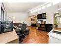 Spacious living room featuring hardwood floors and large window at 3111 Troy St, Aurora, CO 80011