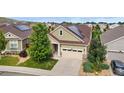 Aerial view of a home in a residential neighborhood, showcasing the roof, yard, and surrounding houses at 6046 Gilbert Way, Golden, CO 80403