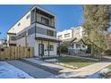 A modern two-story home with a small front yard and contemporary architectural design at 1715 Grove St, Denver, CO 80204