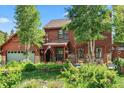 Charming home with a covered front porch and mature landscaping at 112 Grey Squirrel Ln, Breckenridge, CO 80424