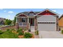 Beautiful home featuring stone accents, neutral siding, and a well-manicured front yard at 265 Calhoun Cir, Castle Rock, CO 80104