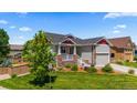 Lovely home with a well-maintained lawn, neutral siding, stone accents, and a welcoming porch at 265 Calhoun Cir, Castle Rock, CO 80104