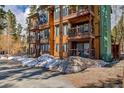 Attractive exterior of a multi-story condo unit featuring balconies and natural landscaping in a serene setting at 820 Columbine Rd # 10, Breckenridge, CO 80424