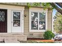 Close-up of townhome exterior showing entrance with white door and window at 2291 S Jasper Way # B, Aurora, CO 80013