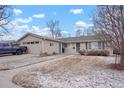 Inviting single-Gathering home featuring a cozy front yard, a covered entry, and an attached garage at 3401 S Glencoe St, Denver, CO 80222