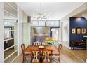 Dining room with pendant lighting connects the kitchen and living spaces at 2432 Champa St, Denver, CO 80205