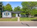 Inviting single-story home with a well-manicured lawn and an appealing exterior at 886 S Jersey St, Denver, CO 80224