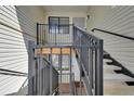 Building exterior showcasing stairs with railings that lead to the entrance at 7835 Barbara Ann Dr # C, Arvada, CO 80004