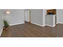 Open-concept living area featuring stylish laminate flooring and neutral paint palette at 7835 Barbara Ann Dr # C, Arvada, CO 80004