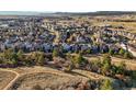 Expansive aerial shot showcasing neighborhood homes and the surrounding landscape at 1271 Sky Rock Way, Castle Rock, CO 80109