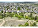 Panoramic aerial showcases the home's location with stunning views and proximity to community amenities at 1271 Sky Rock Way, Castle Rock, CO 80109