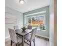 Cozy dining room featuring a large window seat, modern decor, and ample natural light at 15149 E Princeton Pl # D, Aurora, CO 80014