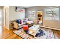 Inviting living room with bright windows, hardwood floors, stylish decor, and a comfortable seating area at 625 Pearl St # 23, Boulder, CO 80302