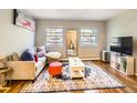 Bright and airy living room featuring a cozy couch, colorful rug, and ample natural light at 625 Pearl St # 23, Boulder, CO 80302