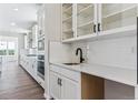 Bright kitchen with modern white cabinets, subway tile backsplash, and stainless steel appliances at 4728 Twelve Oaks Way, Castle Rock, CO 80104