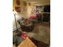 Cozy living room featuring a recliner and access to a deck at 1300 S Parker Rd # 305, Denver, CO 80231