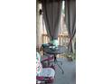 Relaxing patio with seating and string lights at 1300 S Parker Rd # 305, Denver, CO 80231