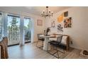 Bright dining area with white table and black chairs, near patio at 460 S Marion Pkwy # 352, Denver, CO 80209