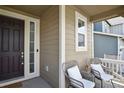 Cozy front porch with seating, creating a welcoming entrance to the home at 13144 E 109Th Pl, Commerce City, CO 80022