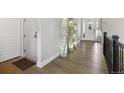 Hallway with decorative features and hard wood floors at 16902 W 94Th Pl, Arvada, CO 80007
