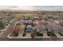 Beautiful neighborhood aerial view showing the lush green spaces, community park, and mountain views at 11539 Depew Ct, Westminster, CO 80020