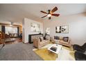 Inviting living room features neutral color palette, plush seating, and large windows at 11539 Depew Ct, Westminster, CO 80020