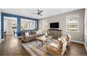 Bright living room with hardwood floors, neutral tones, and stylish furniture arrangement at 2393 Yosemite St, Denver, CO 80238