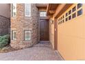Inviting entryway with a double door and a stone facade at 7882 Vallagio Ln, Englewood, CO 80112