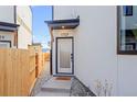 Inviting modern front door, complete with welcome mat, and stylish design at 1727 Lowell Blvd, Denver, CO 80204