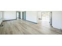 Bright and airy living room featuring sleek floors and modern finishes at 7810 Larkwood St, Commerce City, CO 80022