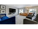 Bright and airy living room with comfortable seating and large windows at 4790 E Dartmouth Ave, Denver, CO 80222
