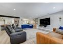 Inviting living area with comfortable seating, large television, and stylish decor at 4790 E Dartmouth Ave, Denver, CO 80222