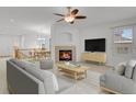 Bright, open living area with a cozy fireplace and modern decor at 2775 S Jebel Way, Aurora, CO 80013