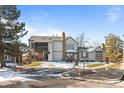 Inviting townhouse complex featuring well-maintained landscaping and appealing architectural details at 17118 E Whitaker Dr # E, Aurora, CO 80015