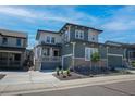 Charming two-story home with a two-car garage and beautifully landscaped front yard at 74 Lullaby Ln, Castle Rock, CO 80109